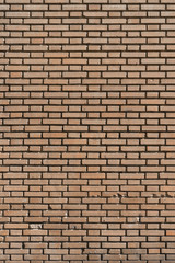 Fondo con textura de muro de ladrillo caravista naranja