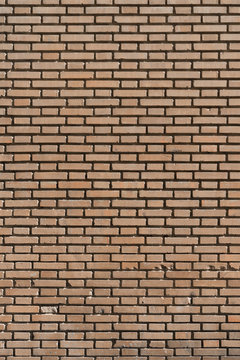 Fondo con textura de muro de ladrillo caravista naranja