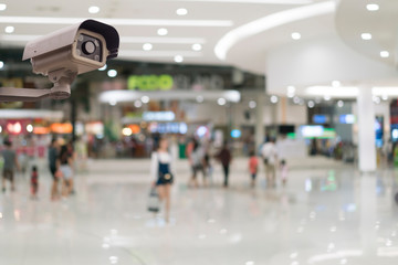 CCTV security camera on blur shopping background