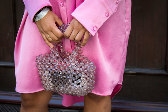 People On The Street During The London Fashion Week. Fragment. Woman Hand Hold Transparent Plastic Bag