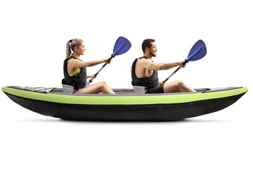 Profile shot of a young man and woman kayaking - Powered by Adobe