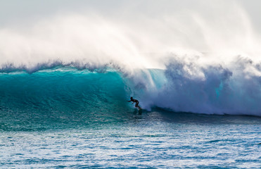 Surfing a wave in Hawaii