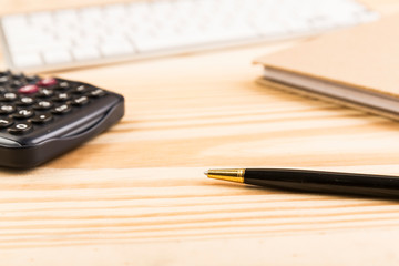 Office table workspace with computer keyboard and calculator