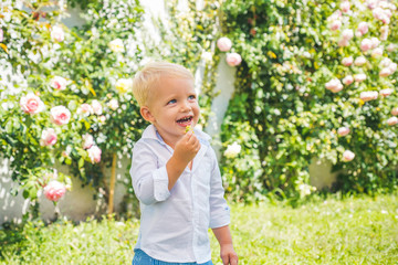 Fun, funny child face. Funny boy. Little child have fun on fresh air. Happy childhood. Little child enjoy walk.