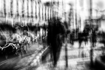 Long exposure of pedestrians walking along the high street - intentional camera shake to introduce...