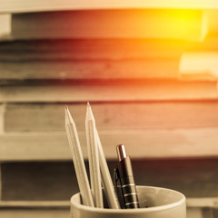 Vintage pencil on old book background