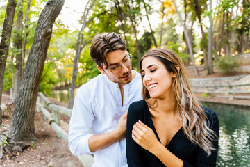 Fototapeta premium Young man flirts with a beautiful woman to propose a date and marriage.