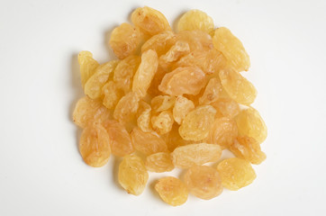 Yellow golden raisins isolated on white background