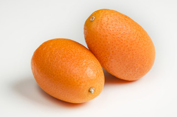 ripe kumquat fruits, isolated on white background