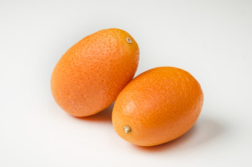 ripe kumquat fruits, isolated on white background