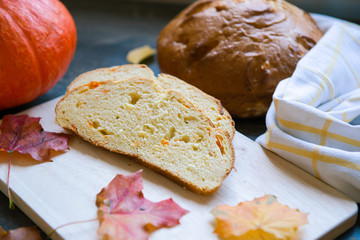 Closeup photo of pumpkin bread on wooden cutting broad