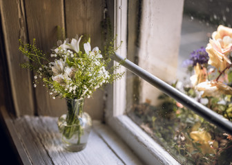 Fototapeta na wymiar flowers on windowsill