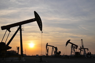 Drilling rig at sunset