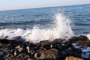 waves crashing on rocks