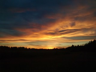 Fototapeta na wymiar Orange clouds in the sky during the sunset