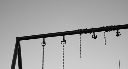 broken swings in the park