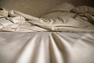 View of bedsheet ripples on a bed