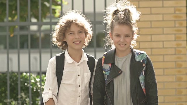 Portraits of children with Backpacks near school - concept of learning