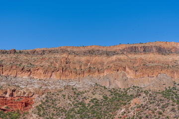 Low angle landscape of multi-colored stone mountain in Jemez National Recreation Area in New Mexico