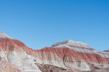Petrified Forest National Park low angle landscape of badlands or banded hills of purple, red and grey
