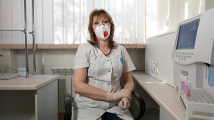 Portrait of a medical laboratory technician with respiration in a laboratory.