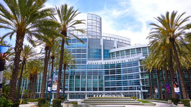 Wide shot of the Anaheim Convention Center with palm trees and fountain. Photo taken July 22, 2019 in Anaheim, CA / USA.