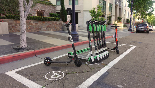 San Diego, CA / USA - May 24, 2019: The city has created dedicated parking spots for dockles bikes and scooters to relieve the hassles of blocked sidewalks in downtown