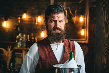 Bearded bartender or waiter in work uniform. Long bearded waiter or servant. Brutal bearded...