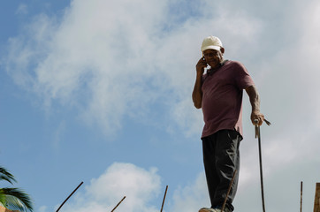 Man On Phone Against Sky Background