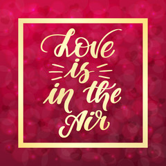 Love is in the air. Handwritten lettering on blurred bokeh background with hearts. Vector illustration for posters, cards and much more.