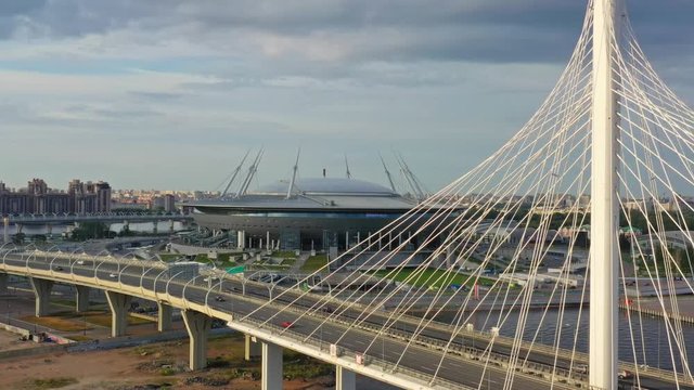 Aerial view of cable-stayed bridge and new stadium in St.Petersburg during sunset, 4k