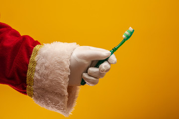 Advise of Santa Claus-brush your teeth well everyday! On yellow background.