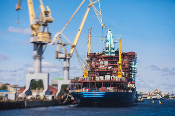 Process of building and construction a massive russian nuclear-powered icebreaker vessel ship in the shipyard dock