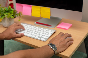 Human hands use computers with blank screens on the table