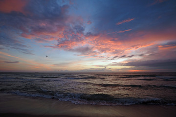 Obraz na płótnie Canvas Sunrise on Miami Beach's South Beach, Florida under dramatic cloudscape.