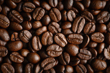 closeup background of roasted arabica coffee beans