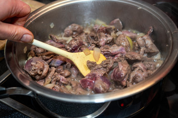 game goulash in pot with stirring spoon