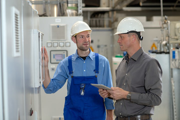  boss with worker in factory