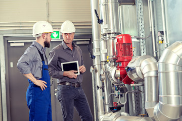  boss with worker in factory