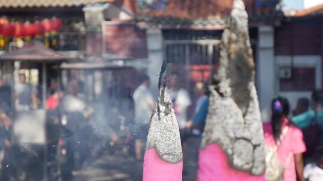Smoke of big Incense sticks during the celebration of Chinese New Year outside the Taoist temple. 4k