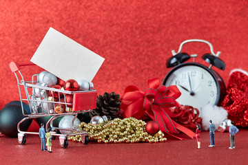 Shopping trolley with gift Christmas balls and credit card
