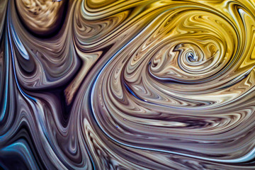 Engine oil that has been changed and mixed with water creates beautiful patterns, can be used to make a background or website