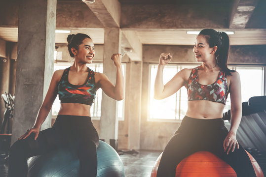 Two Women In Sportswear Workout At The Gym, Cinematic Tone