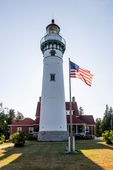 lighthouse with USA flag