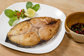 spanish mackerel steak on wood background,fried fish