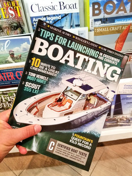 Boating magazine in a hand
