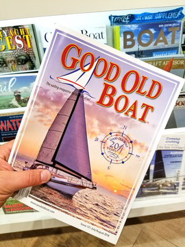 Good Old Boat magazine in a hand