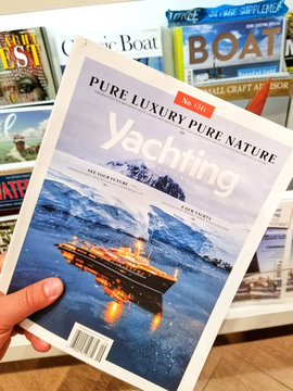 Yachting magazine in a hand