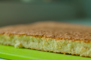 Cutting biscuit. Baking on a green background.
