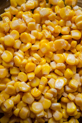 Canned corn in a plate before cooking. Corn background.